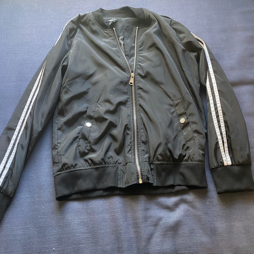 Black bomber jacket with white striped sleeves